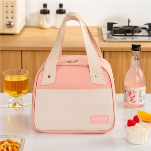 Pink and beige insulated trapezoid lunch bag with Tasty Food label and sturdy handle