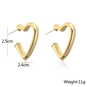 Minimalist 18K gold plated hollow heart-shaped earrings with reflective studio lighting