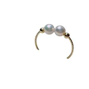 Elegant gold open ring featuring dual white pearls and a twisted spiral texture design