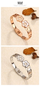 Detail of rose gold and silver double flower spring open bangles with zircon and enamel
