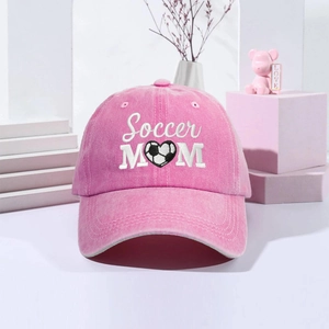 Detailed view of pink washed cotton baseball cap with Soccer MOM heart embroidery