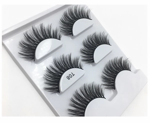 Macro view of T08 thick 3D faux mink eyelashes with dense layered volume in a white tray