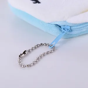 Cute plush unicorn coin purse in light blue with white fur and metal keychain chain