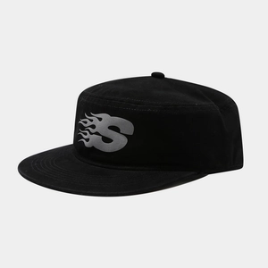 Detail of black cotton flat top cadet hat featuring grey flame letter S streetwear logo
