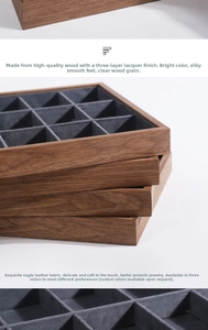 Detail of walnut wood jewelry tray showing grey microfiber lining and clear grain finish