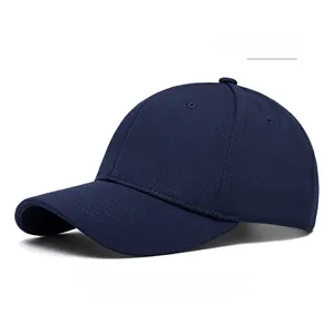 Detailed close-up of navy blue six-panel baseball cap with breathable fabric and curved brim