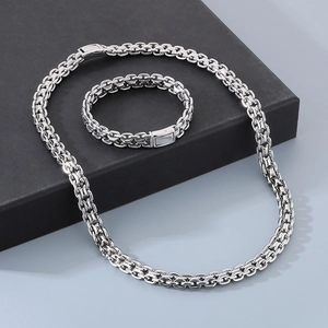 Hip hop style 10mm stainless steel necklace and bracelet set displayed on a black box