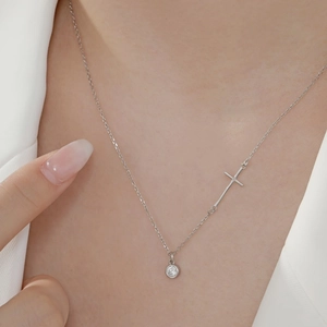 S925 sterling silver necklace featuring cross and round zircon pendant on a model