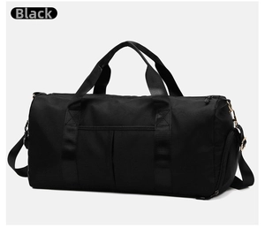 Detailed view of black gym bag featuring durable nylon fabric and gold metal buckles