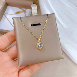 Luxurious gold-plated titanium steel necklace with a hollow zircon circular pendant