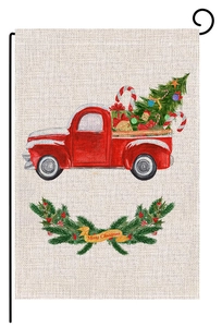 Detail of Christmas garden flag showing a red truck and Merry Christmas wreath pattern