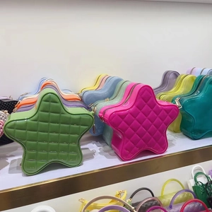 Detailed view of colorful star-shaped jelly bags with quilted diamond patterns on shelf