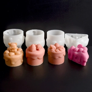 Detail view of silicone molds with 3D bear and strawberry dessert cake creations