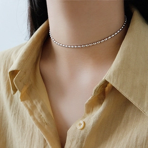Elegant S925 sterling silver olive bead choker necklace shown on model neck