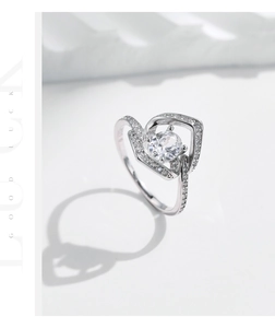 Macro shot of S925 sterling silver ring with sparkling heart shaped zircon and engraving