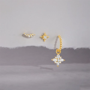 Detailed macro view of 18K gold plated S925 silver earring set with white zircon stars