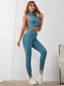 Detailed ribbed knit texture on blue three-piece yoga set with crop top and leggings