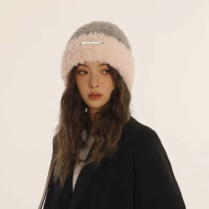 Pink and grey contrast plush knit hat with soft fleece texture for winter warmth