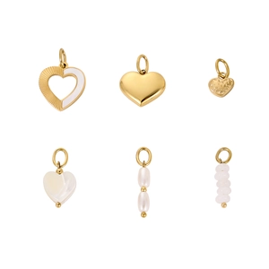 Detail of gold charms featuring heart shapes, white enamel, pearls, and pink quartz beads