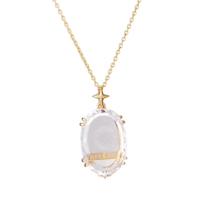 Vintage 18K gold plated Tarot Sun necklace featuring transparent crystal pendant on white back