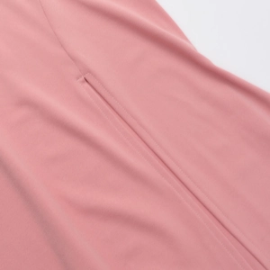 Close-up of seamless stitching and premium fabric texture on this pink dress detail