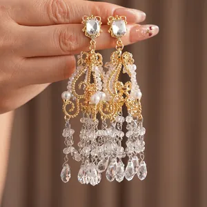 Baroque style gold chandelier earrings with glass tassels and pearls for formal events