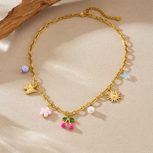 Gold-plated chain necklace featuring colorful enamel cherry, butterfly, and sun pendants