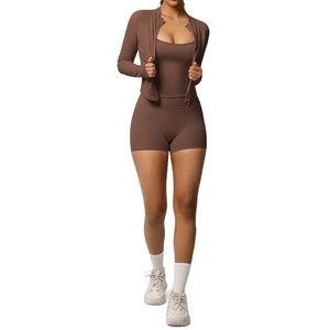 Three-piece chocolate brown yoga set with zip-up jacket, square neck tank, and high waist shorts