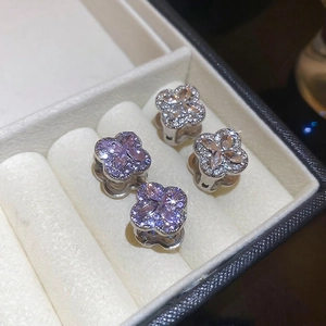 Diamond clover earrings with purple and white stones in a luxury silver-toned setting
