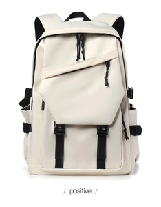 Detailed front view of off-white nylon backpack featuring black straps and buckle closures