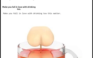 Close-up of a funny silicone butt-shaped tea infuser straining tea in a clear glass cup
