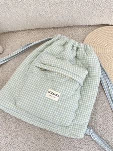 Blue and yellow plaid quilted drawstring backpack with heart embroidery and front zipper pocket