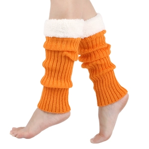 Close-up of orange cable knit leg warmers featuring soft white faux fur trim detail
