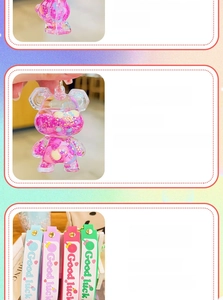Macro view of cartoon bear liquid keychain with floating glitter and Good Luck strap