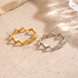Minimalist 18K gold plated wavy open rings in gold and silver finish on stone base