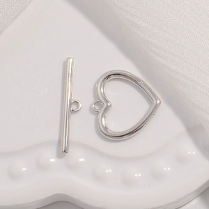 Detailed view of polished S925 sterling silver heart-shaped toggle clasp for DIY jewelry