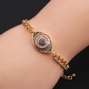 Detail of adjustable evil eye bracelet with colorful zircons and golden Cuban link chain