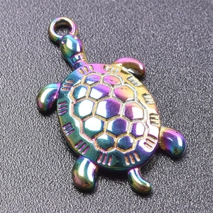 Macro view of a rainbow-plated stainless steel turtle pendant with shell textures