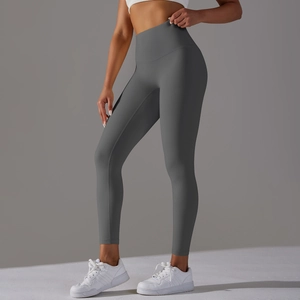 Close-up of dark grey high-waisted yoga leggings showing seamless fit and elastic fabric