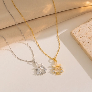 Elegant floral pendant necklace with rhinestones in gold and silver finishes