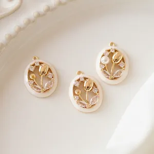 Gold tulip pendant with white enamel oval frame, zircons and pearls in French vintage style