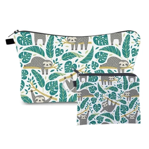 Travel makeup bag set with sloth and tropical leaf print including a matching coin purse