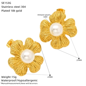 Detail view of 18k gold plated stainless steel flower earrings with 10mm pearl inlay
