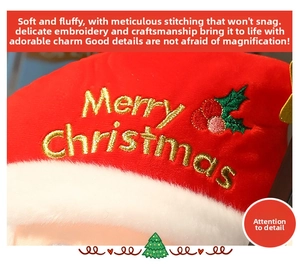 Detail of Christmas hat featuring gold Merry Christmas embroidery and holly leaf decor