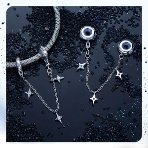 Macro detail of S925 sterling silver starburst safety chain with sparkling zircon stones