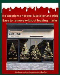 Detail of four golden Christmas tree window stickers on a glass door for festive decor
