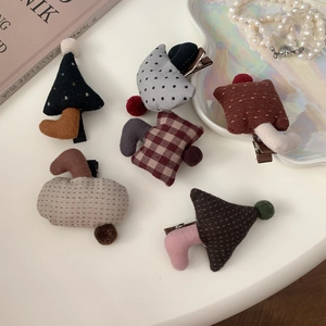 Cute mushroom-shaped fabric hair clips for children featuring polka dots and plaid patterns