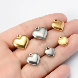 Polished stainless steel heart pendants in gold and silver colors with various sizes