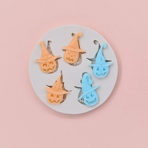 Halloween silicone mold featuring pumpkin and ghost shapes with witch hats for DIY baking
