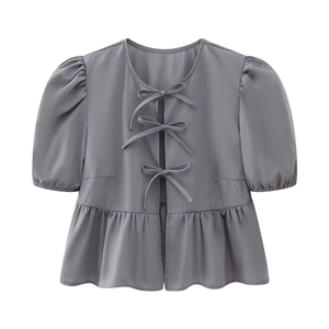 Grey puff short sleeve blouse with front bow ties and peplum hem on white background